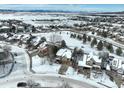 Community overview with snowy landscape and houses at 3925 Broadview Pl, Castle Rock, CO 80109