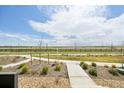 Tranquil view from the property showcasing the beautiful landscape and serene walking paths in the neighborhood at 5278 Warrior St, Frederick, CO 80504