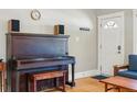 Cozy living room featuring a vintage piano and bright natural light at 3415 N Vine St, Denver, CO 80205