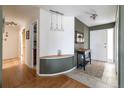 Bright entryway with tiled floor, modern lighting, and stylish table decor at 6847 S Hill St, Littleton, CO 80120