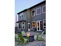 Home exterior featuring a patio with a fire pit and green Adirondack chairs for outdoor enjoyment at 5893 Lasso Pl, Parker, CO 80134