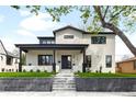 Stunning two-story home with a modern exterior, landscaped front yard, and welcoming entrance at 1462 S Vine St, Denver, CO 80210