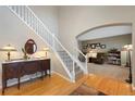 Elegant entryway showcasing hardwood floors, stairs, and decoratively furnished with tasteful accents at 20460 Oakbrook Ln, Parker, CO 80138