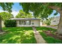 A well maintained single story home with nice curb appeal and a lush front lawn at 2571 S Birch St, Denver, CO 80222