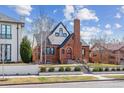 Charming brick home with manicured lawn and front garden, offering classic curb appeal at 474 S Gaylord St, Denver, CO 80209