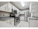 Modern kitchen with stainless steel appliances at 3184 S Heather Gardens Way # 403, Aurora, CO 80014