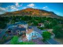 An aerial view featuring the house nestled amongst the other neighborhood properties at 420 Sunshine Pkwy, Golden, CO 80403