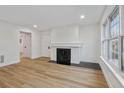 Bright living room with a fireplace and wood floors at 9120 E Girard Ave # 12, Denver, CO 80231
