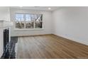 Bright living room with a fireplace and wood floors at 9120 E Girard Ave # 12, Denver, CO 80231