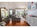 Open concept living room featuring wood floors, large windows and upscale furniture at 1488 Madison St # 307, Denver, CO 80206