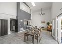 Spacious living area with high ceilings, modern decor, and a seamless flow to the dining and kitchen areas at 837 E 17Th Avenue # 2K, Denver, CO 80218