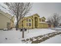 Two story house in winter with snow on the ground and trees at 17624 E Peakview Ave, Aurora, CO 80016