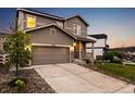 Traditional home with a two-car garage and nicely landscaped front yard at 2633 Garganey Dr, Castle Rock, CO 80104
