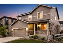 Charming two-story home with a covered porch and well-maintained landscaping at 2633 Garganey Dr, Castle Rock, CO 80104