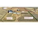 Aerial view of property highlighting the land features, buildings, and landscaping at 7686 County Road 21, Fort Lupton, CO 80621