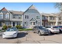 Attractive townhome with neat landscaping, convenient parking, and welcoming entrance at 9659 W Cornell Pl, Lakewood, CO 80227