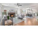 Inviting living room with a cozy fireplace, hardwood floors, and an open layout at 2659 Ash St, Denver, CO 80207