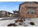 A beautifully designed house with a welcoming porch and a well-maintained front yard at 4078 Happy Hollow Dr, Castle Rock, CO 80104