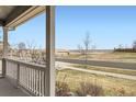 Scenic view from the covered front porch, showcasing the neighborhood at 12185 S Grass River Trl, Parker, CO 80134