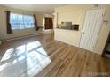 Bright living room featuring recently refinished hardwood floors and ample natural light at 7309 W Hampden Ave # 5202, Lakewood, CO 80227