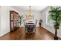 Formal dining area with hardwood flooring, stylish lighting, and ample seating space at 4788 Briar Ridge Trl, Boulder, CO 80301