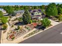 Beautiful two-story home with solar panels, manicured landscaping, and mature trees on a corner lot at 21395 E Greenwood Pl, Aurora, CO 80013