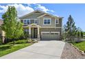 Attractive two-story home featuring a covered porch and attached two-car garage at 19782 W 59Th Ave, Golden, CO 80403