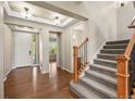 Inviting foyer with hardwood floors and a staircase leading to the upper level at 19782 W 59Th Ave, Golden, CO 80403
