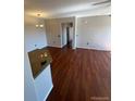 Living room featuring an open floor plan, recessed lighting, hardwood floors and neutral walls at 2705 S Danube Way # 304, Aurora, CO 80013