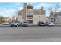 Condo building exterior with assigned parking spots and multiple balconies at 4866 S Dudley St # 9, Littleton, CO 80123