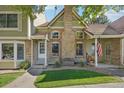 Charming two-story townhome with landscaping and a front porch at 2103 Ranch Dr, Westminster, CO 80234