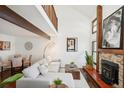Spacious living area with hardwood floors, fireplace, and loft at 2103 Ranch Dr, Westminster, CO 80234