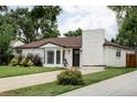 Attractive one-story home with brick details, updated windows, and a well-maintained yard at 2941 Oneida St, Denver, CO 80207