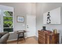 Bright entryway featuring hardwood floors and stylish decor at 7696 S Hudson Way, Centennial, CO 80122