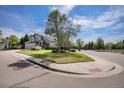 Lovely two-story home with a well-maintained lawn on a corner lot at 7696 S Hudson Way, Centennial, CO 80122