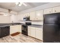 Functional kitchen featuring modern appliances and light-colored cabinets at 2215 E Geddes Ave # P08, Littleton, CO 80122