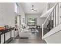Bright living room with tall ceilings, large windows, and modern decor at 1371 W 133Rd Way, Denver, CO 80234
