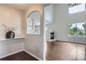 Open concept living area with fireplace and rich, wood-look floors at 11029 Grouse Ct, Parker, CO 80134