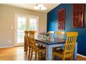 Bright dining room features a large table, seating for six, and natural light at 7328 S Kit Carson St, Centennial, CO 80122