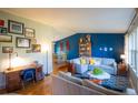 Inviting living room featuring hardwood floors, comfortable seating, and stylish decor at 7328 S Kit Carson St, Centennial, CO 80122