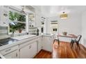 Bright kitchen featuring a retro design, ample natural light, and hardwood floors at 113 S 4Th Ave, Brighton, CO 80601