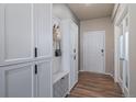 Well-organized mud room with built-in storage cabinets and a convenient bench with storage at 18103 House Finch Ln, Parker, CO 80134