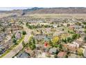 Beautiful aerial view of the neighborhood and surrounding mountainous terrain at 10866 W Half Moon Pass, Littleton, CO 80127