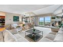 Inviting living room features plush seating, a fireplace, and sliding doors leading to an outdoor view at 7160 W Stetson Pl # 27, Littleton, CO 80123