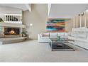 Spacious living room with a fireplace, modern artwork, and a large sectional sofa at 7160 W Stetson Pl # 27, Littleton, CO 80123