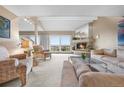 Bright living room featuring a fireplace, neutral carpeting, and large sliding glass doors to the exterior at 7160 W Stetson Pl # 27, Littleton, CO 80123