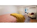 Bedroom with wood floors and a view of another room at 1581 N Ogden St, Denver, CO 80218