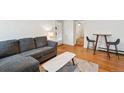 Spacious living room with a comfortable gray sectional sofa and modern coffee table at 1581 N Ogden St, Denver, CO 80218