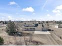 Expansive aerial view of a beautiful two-story home with mountain views at 15543 Quivas St, Broomfield, CO 80023