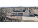 Beautiful two-story home featuring a welcoming front porch and a spacious driveway at 15543 Quivas St, Broomfield, CO 80023